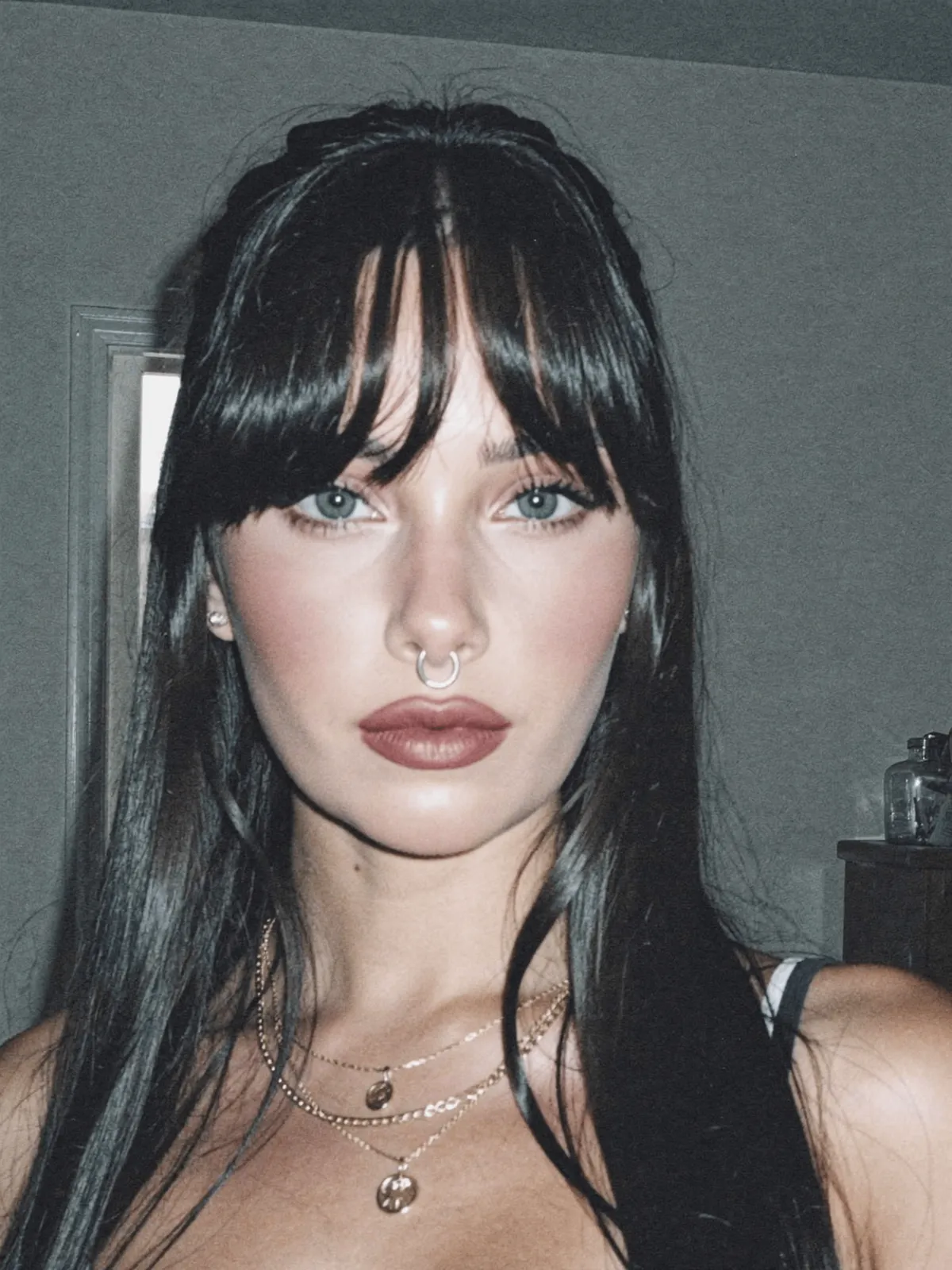 Face With Dark Hair And Septum Piercing