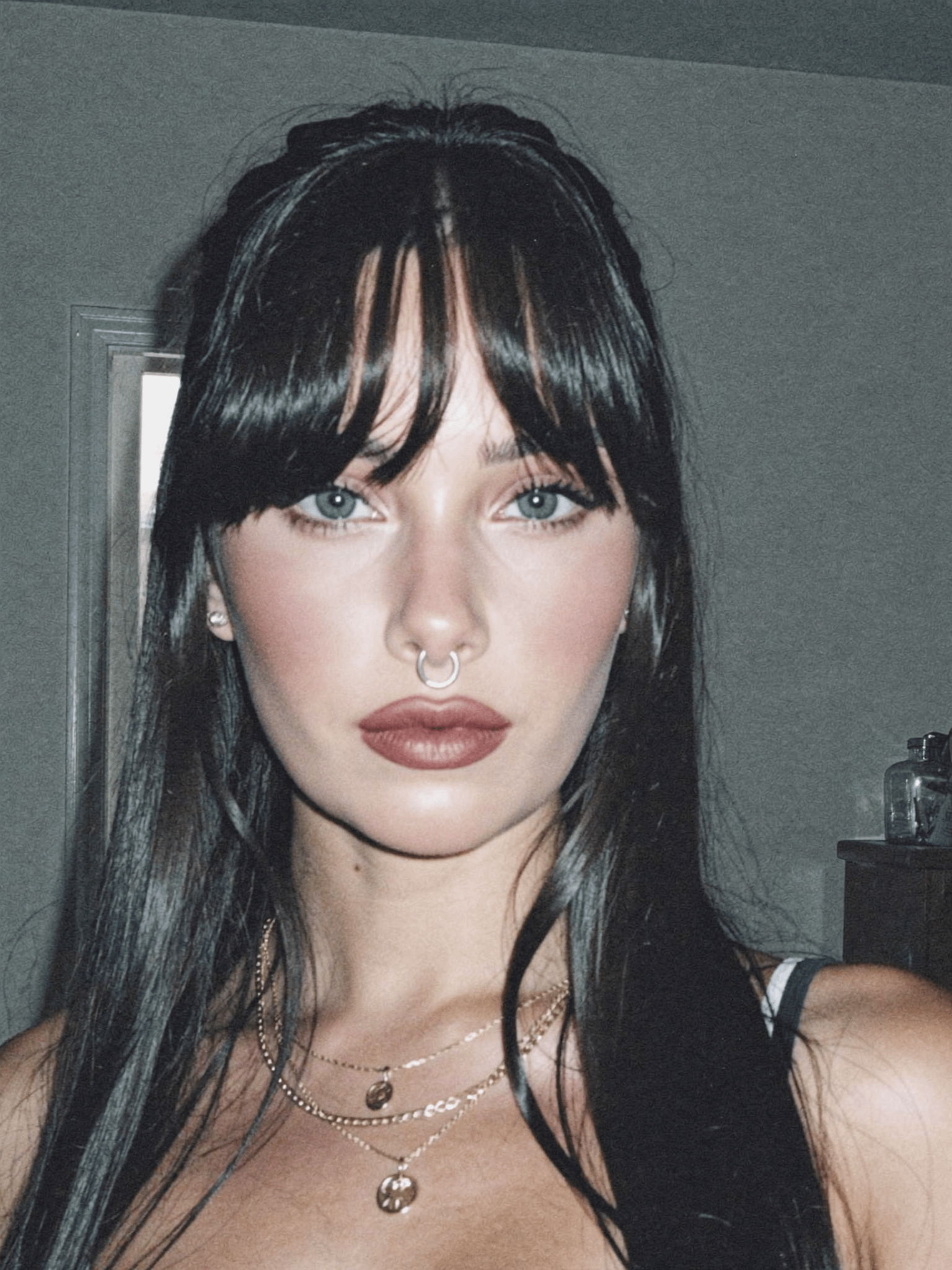 Face With Dark Hair And Septum Piercing