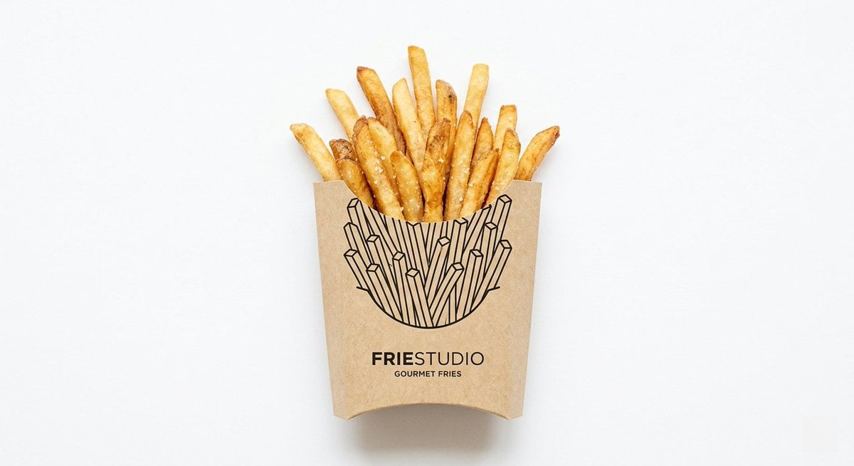 Real food item emerging from paper packaging with a black line illustration seamlessly integrated into the surface.