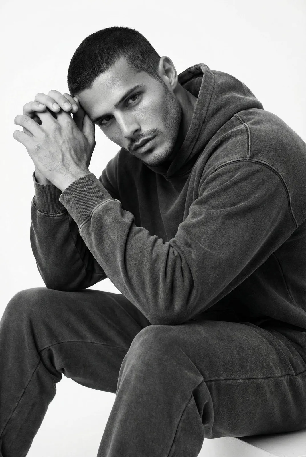 Realistic Black White Seated Hoodie Portrait