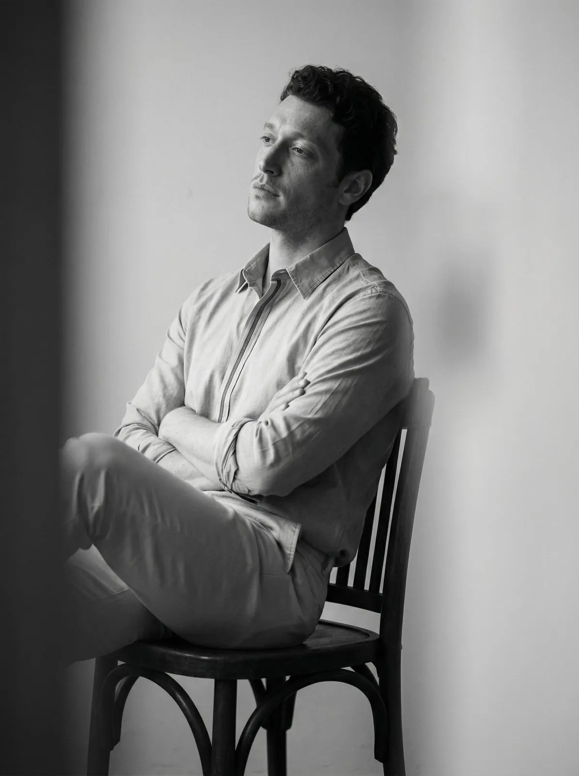 Man Seated Blurred Foreground Monochrome