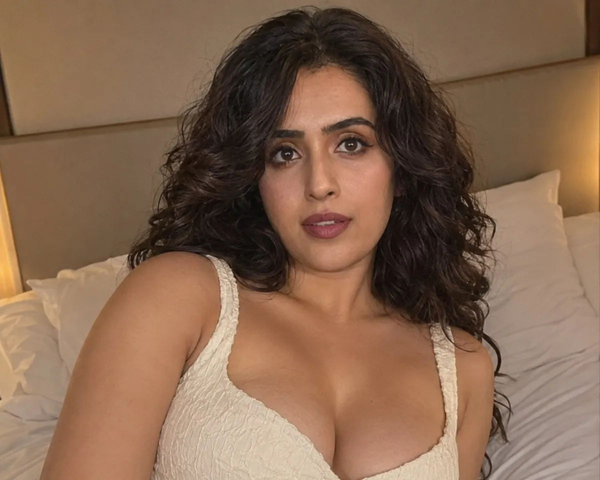 Cream Top Sitting On Bed Soft Lighting