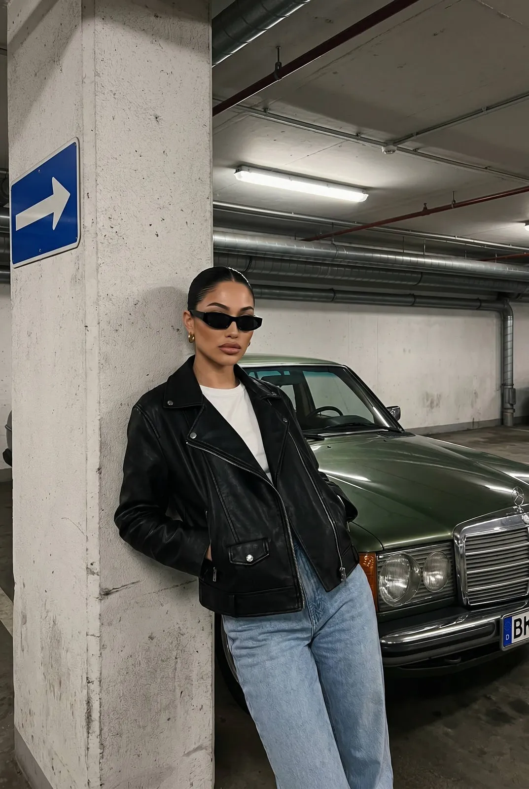 Sunglasses And Makeup And Earrings With Black Leather Jacket