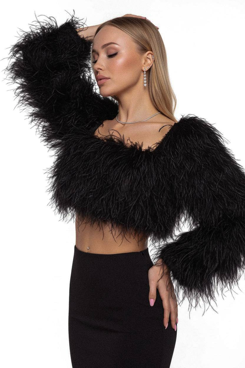 A model poses gracefully in a feathered outfit, showcasing elegance with closed eyes and soft lighting against a minimalist studio backdrop.