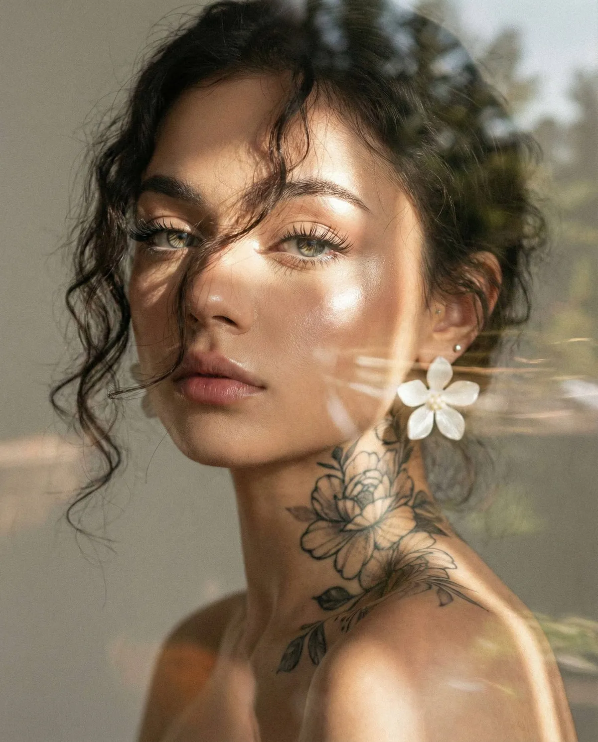 Tattoos And Makeup And Earrings In Styled Portrait