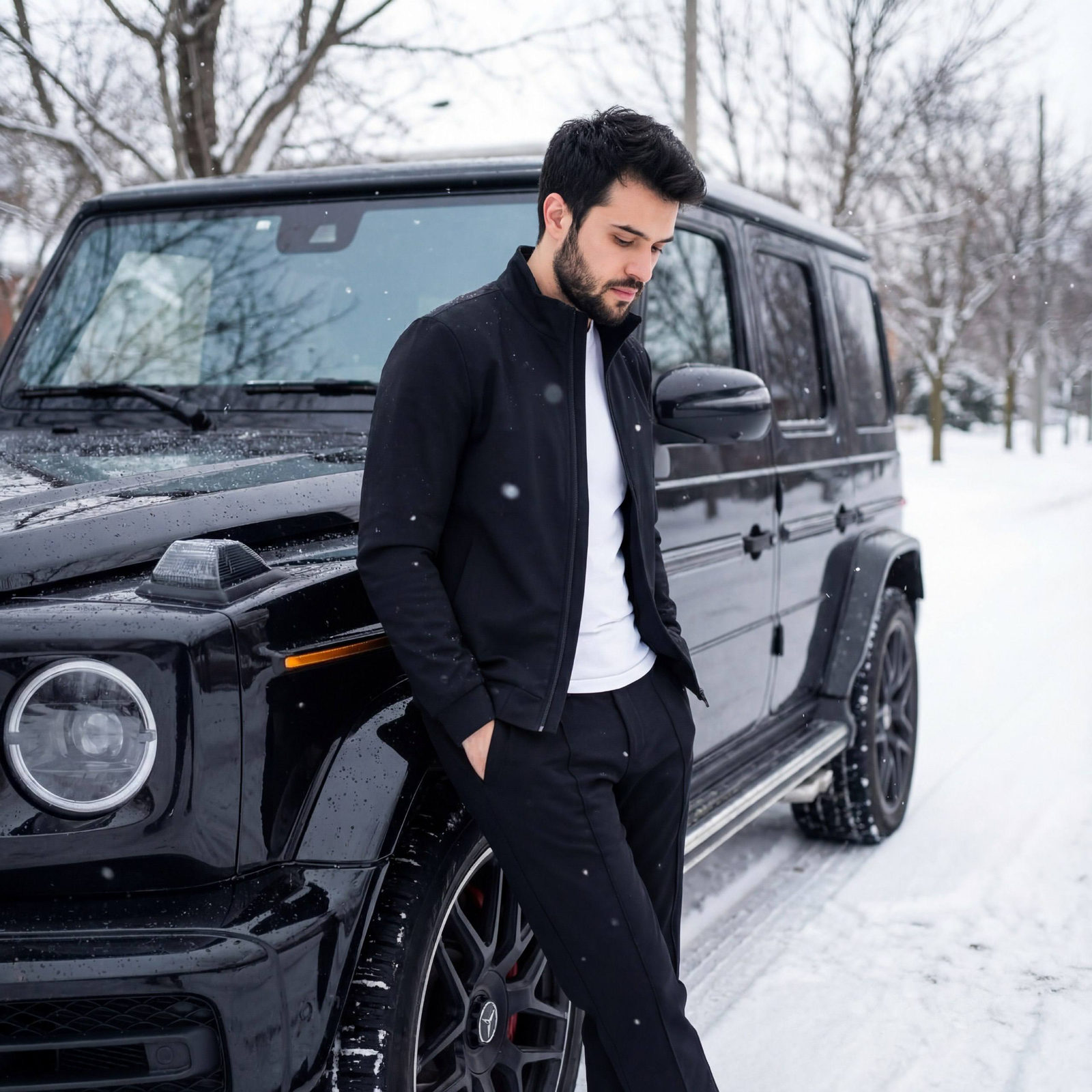 A stylish person leaning against a Mercedes G-Wagon in winter, dressed in a minimalist jacket and fitted trousers.