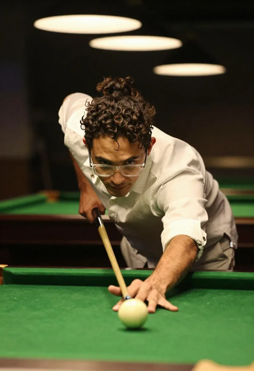 Young Man With Curly Dark Hair Tied Back Ponytail Leans