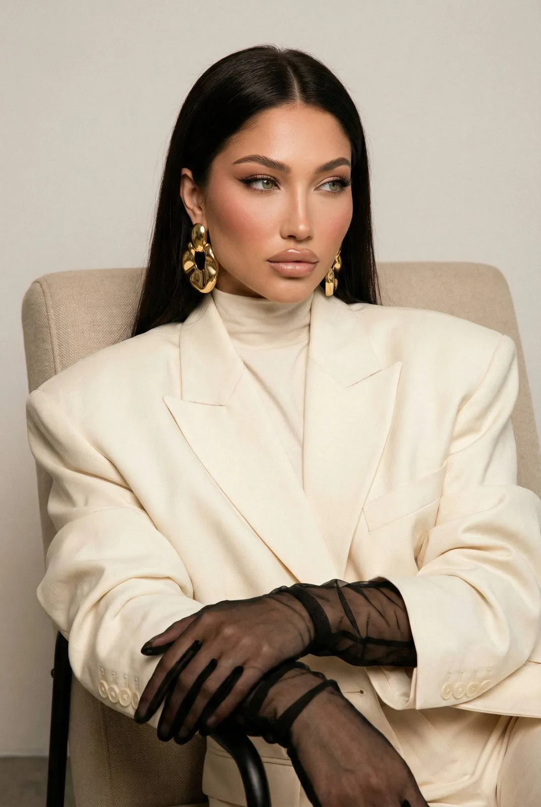 Elegant Woman Beige Armchair Studio Portrait