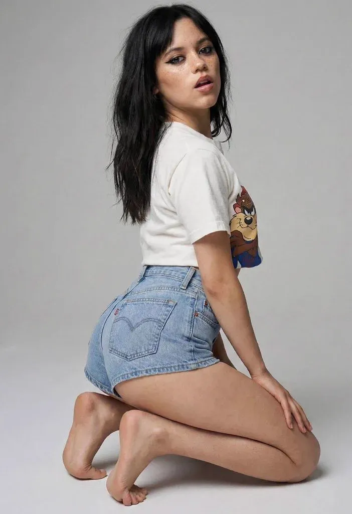 Dark Haired Woman Kneeling Studio Background