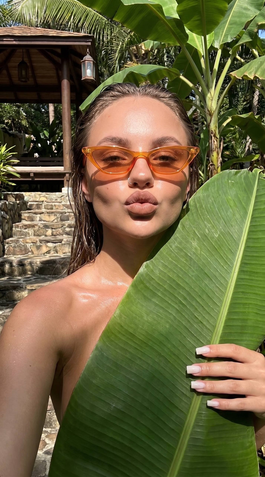 Orange Narrow Cat Eye Sunglasses In Tropical Garden reference photo