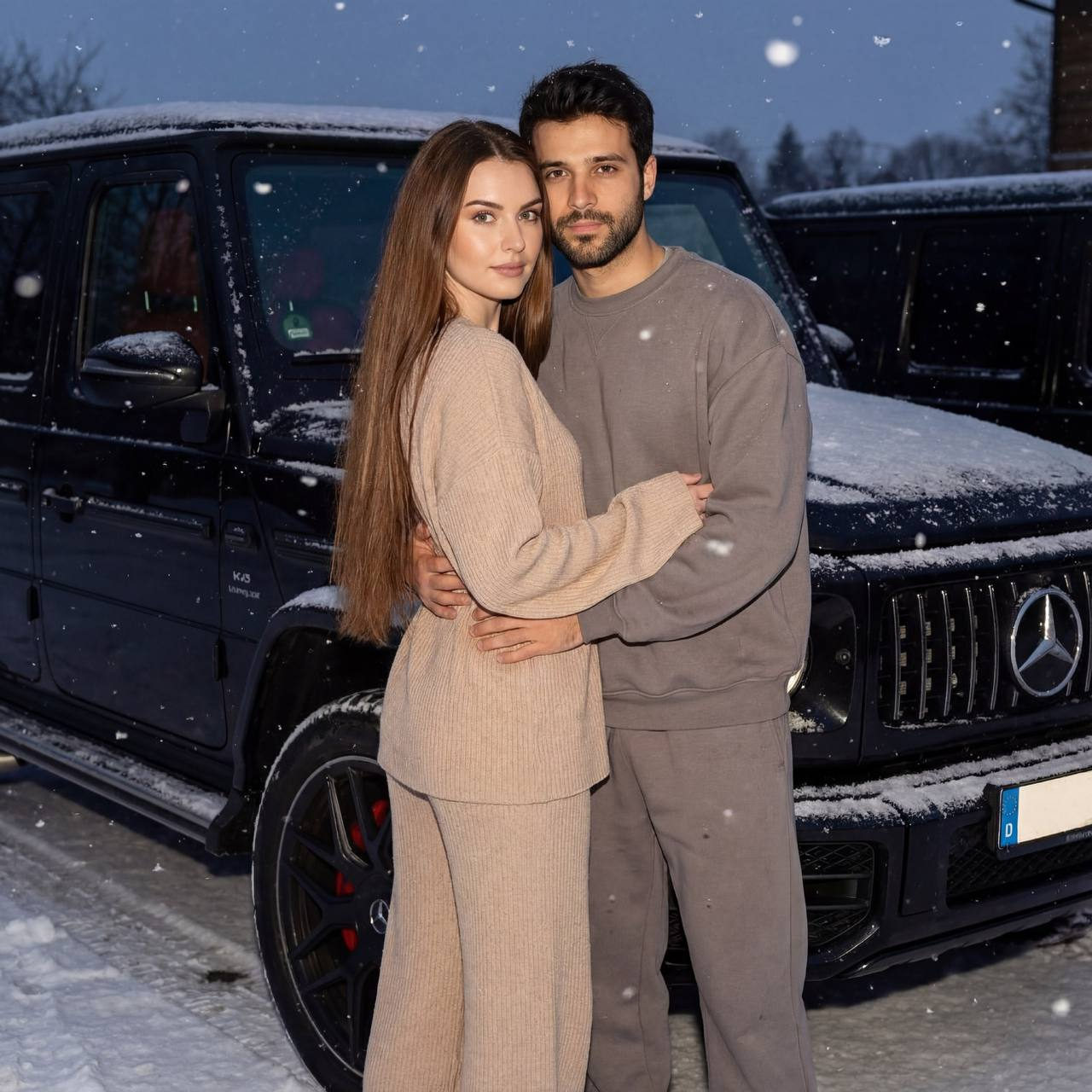 Couple in beige knitted suit and grey tracksuit by Mercedes-Benz G-Wagon in a snowy twilight setting.
