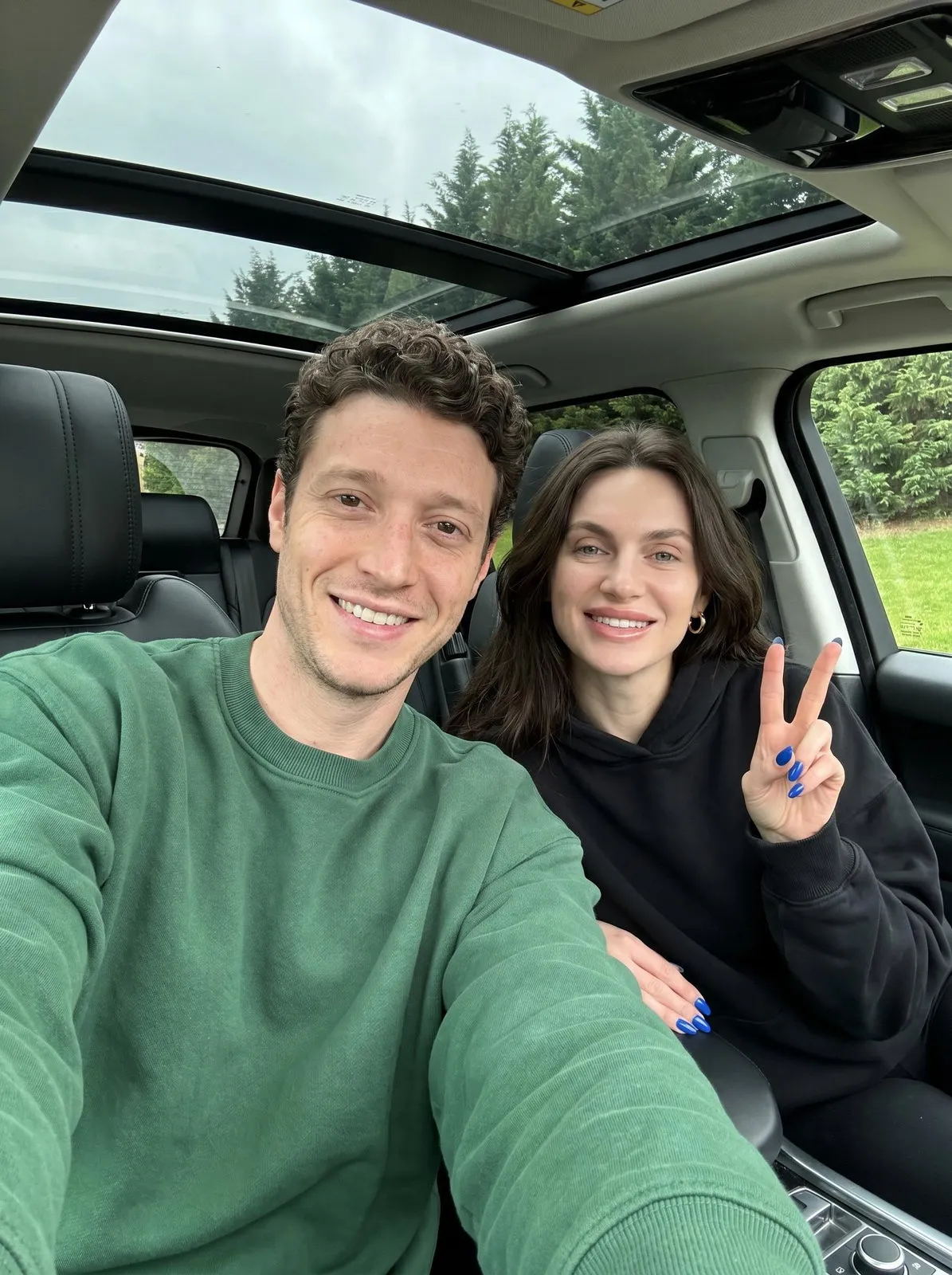 Car Selfie Couple Peace Sign Outstretched Arm Shot