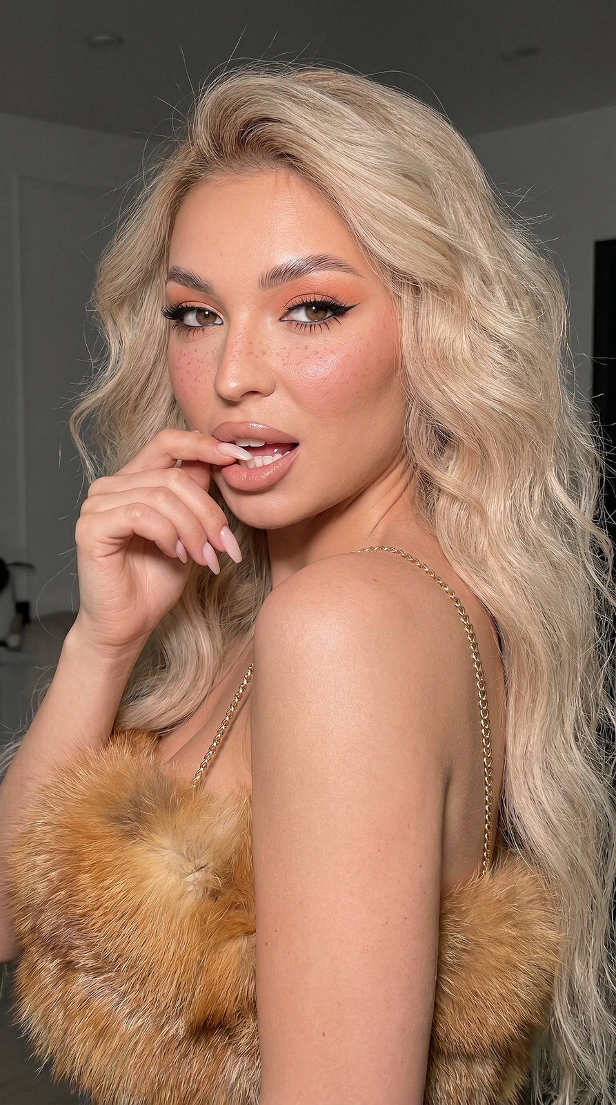 Girl With Fox Fur Top And Peachy Eye Makeup