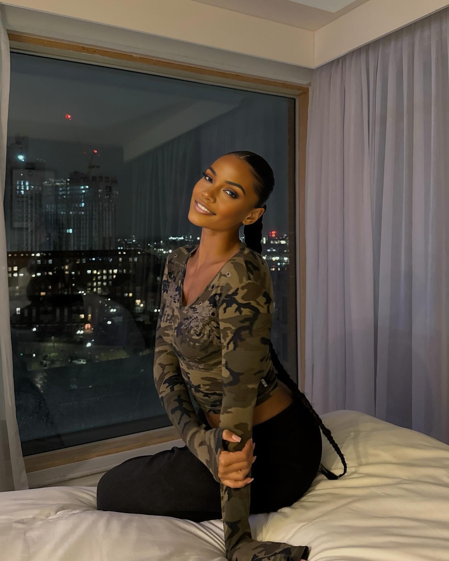 Camouflage Crop Top On Hotel Bed Night City View