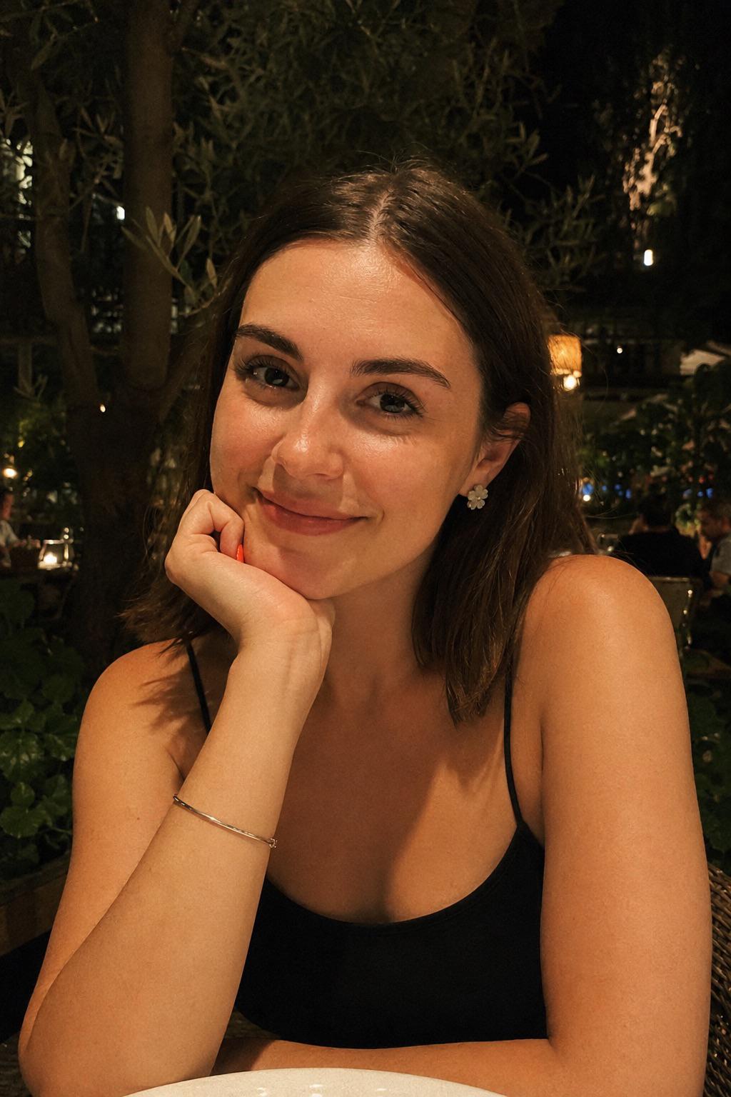 Outdoor Restaurant Night Portrait Gentle Smile Black Camisole