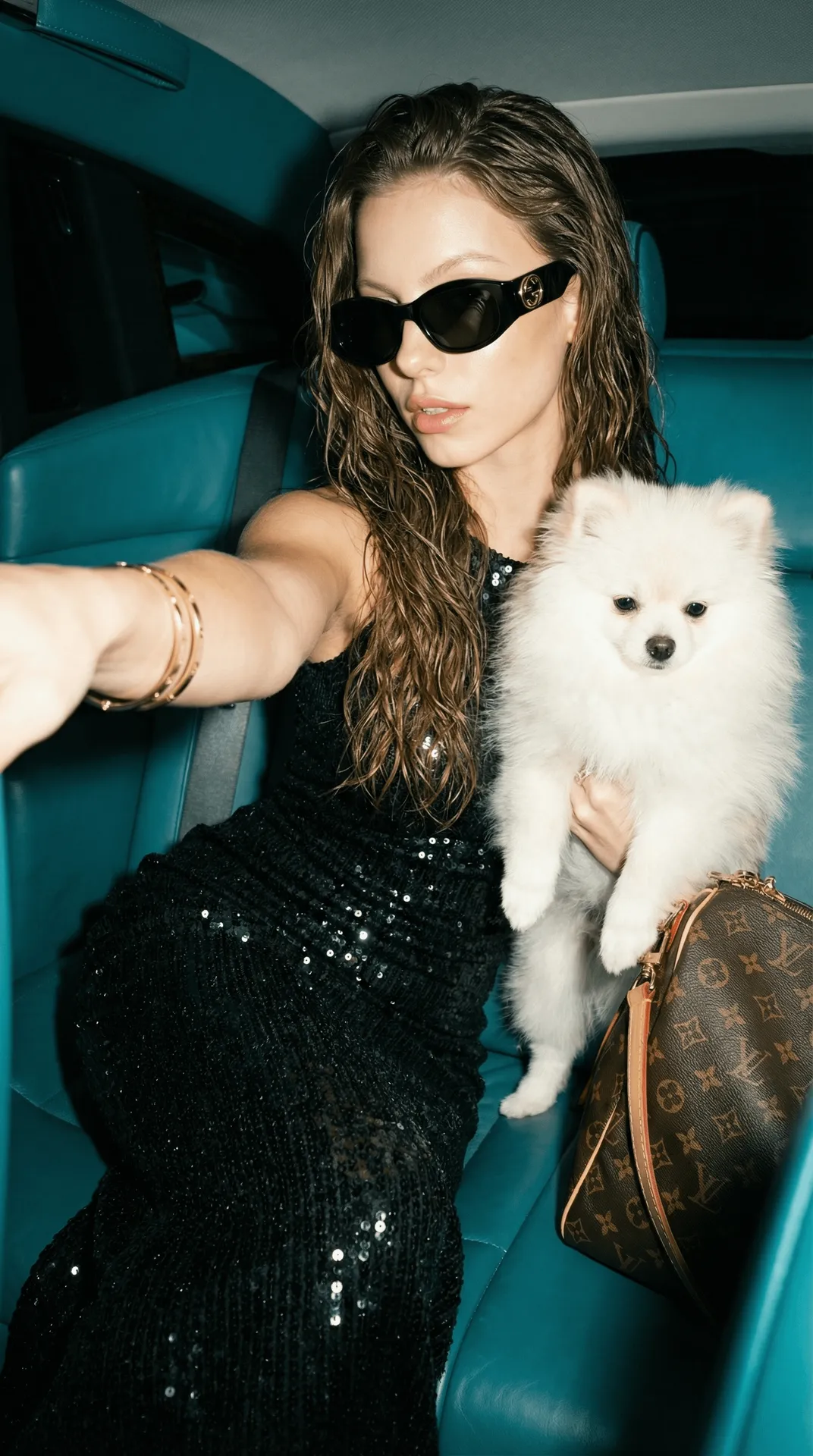 Sunglasses And Bracelets By A Car