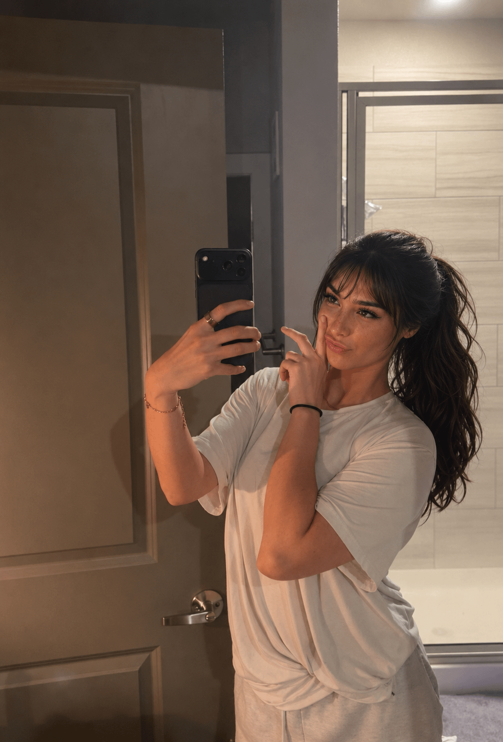 Bathroom Mirror Selfie Playful Expression White T Shirt