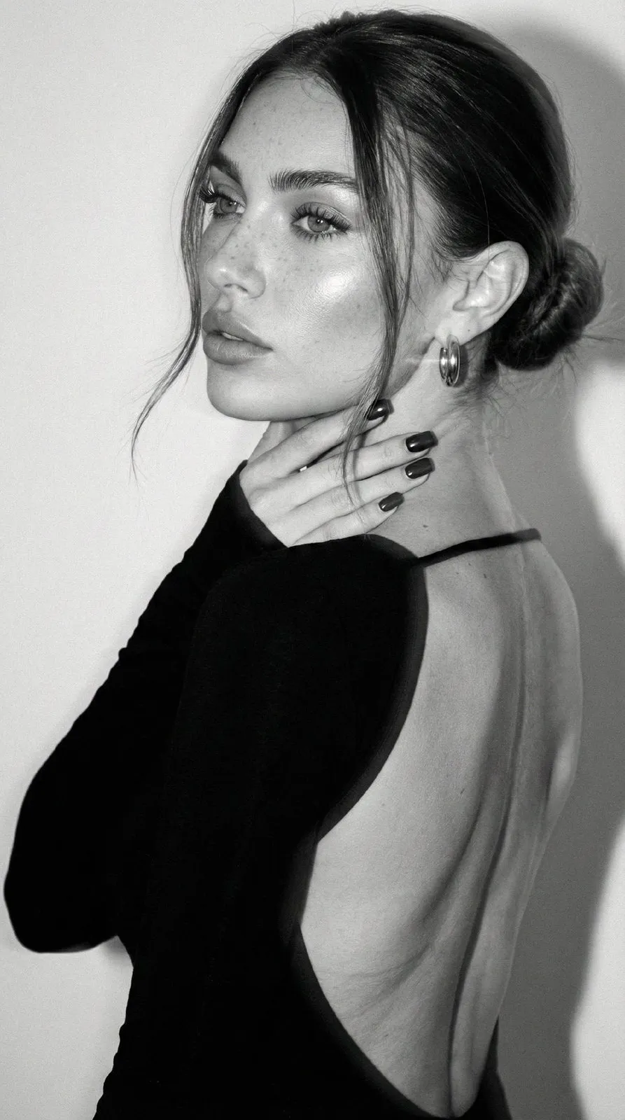 Makeup And Earrings And Manicure With Black Dress