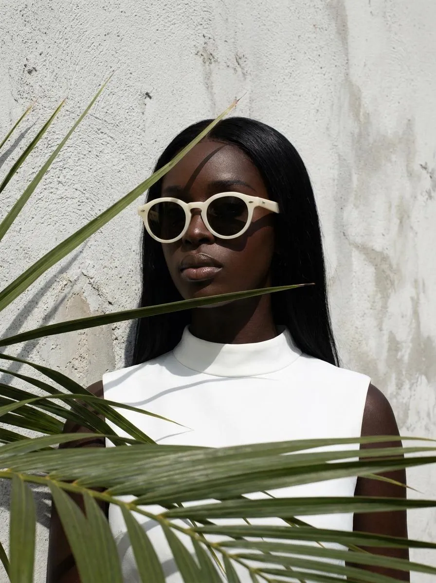 Sunglasses And Makeup With Palm Frond Shadows