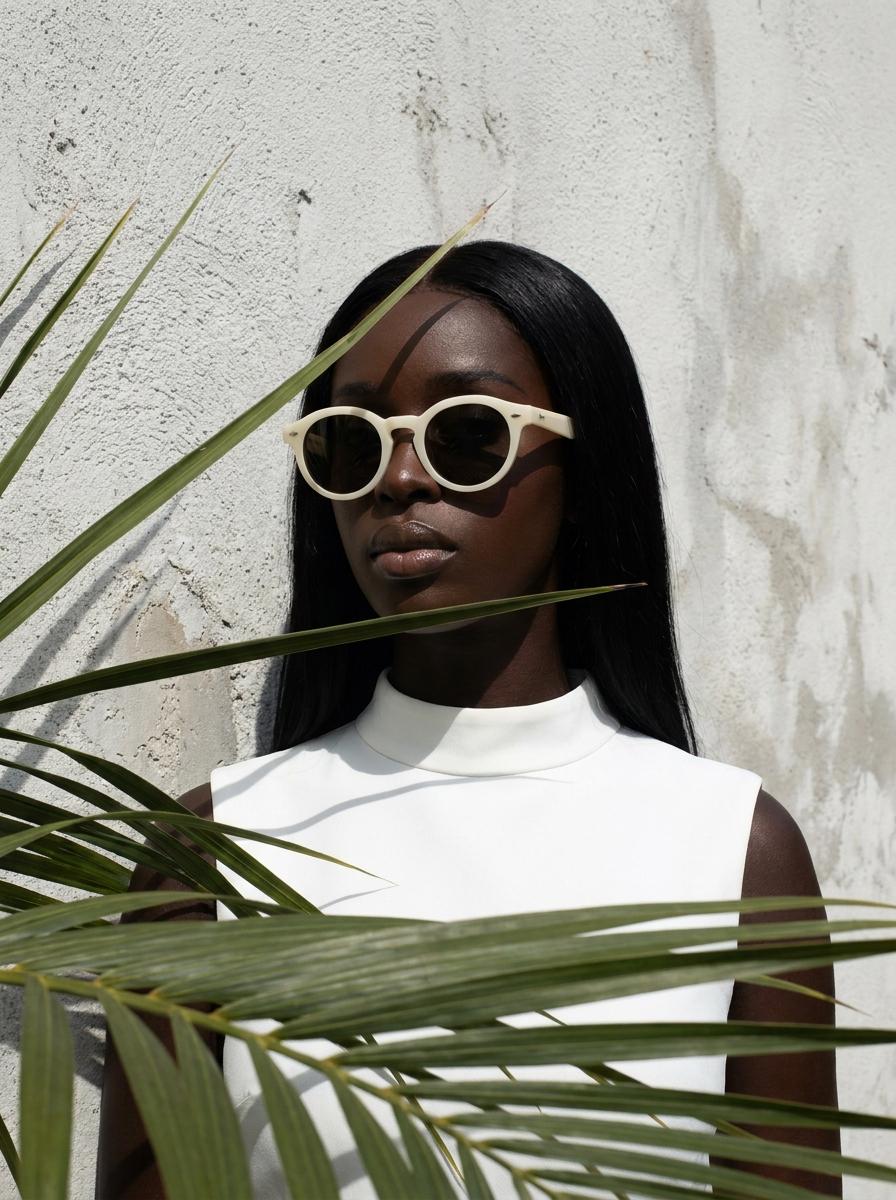 Standing By Stucco Wall Palm Fronds Foreground Editorial