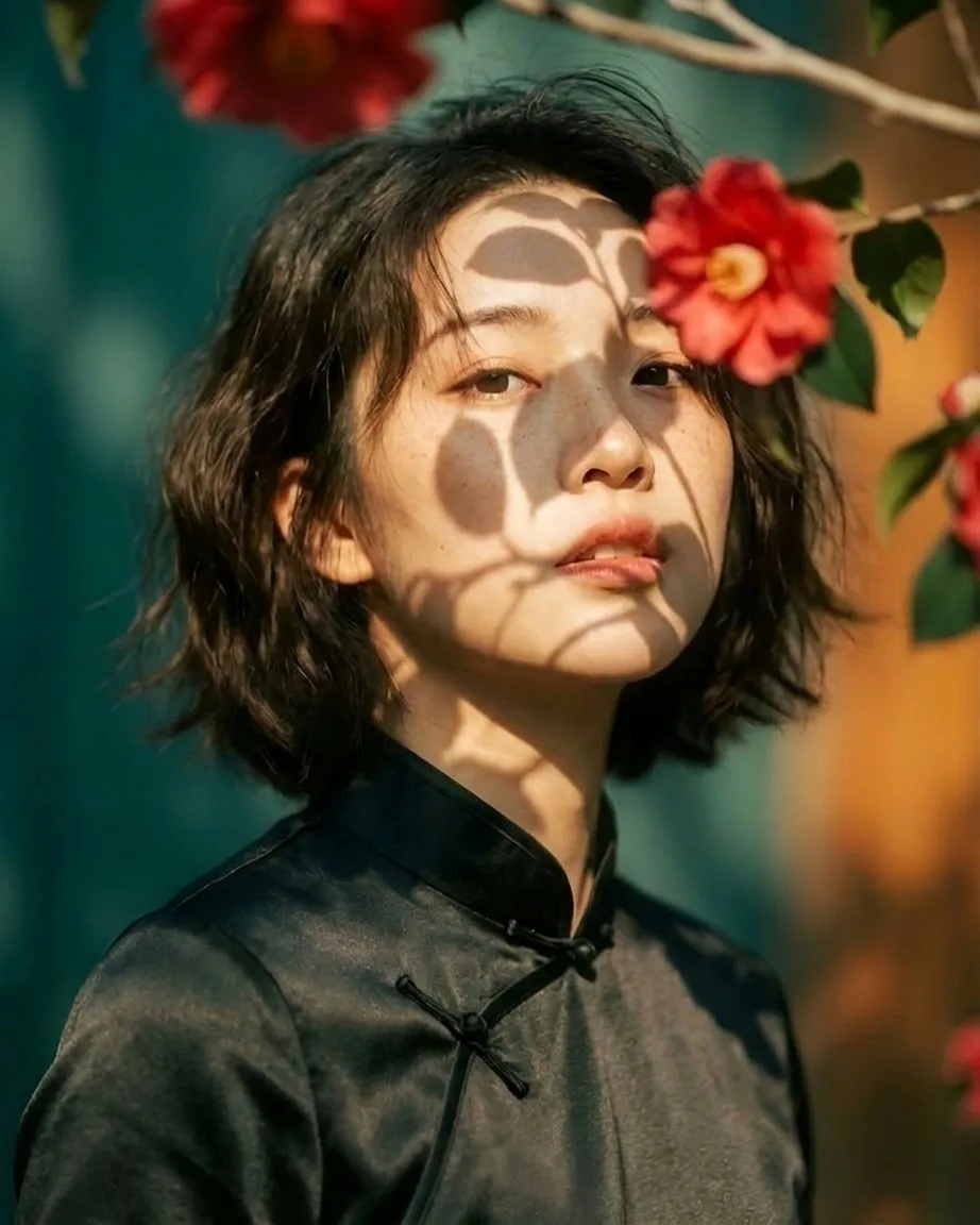 Artistic portrait of an elegant Asian woman wearing a bla...