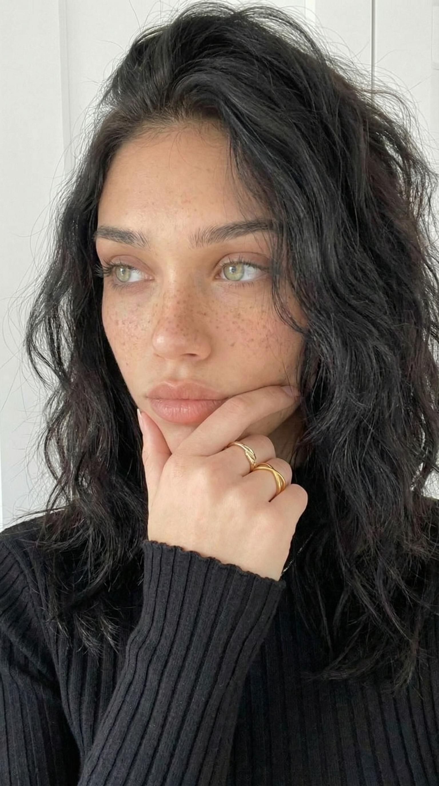 Wavy Dark Shoulder Length And Light Colored Eyes Looking Off reference photo