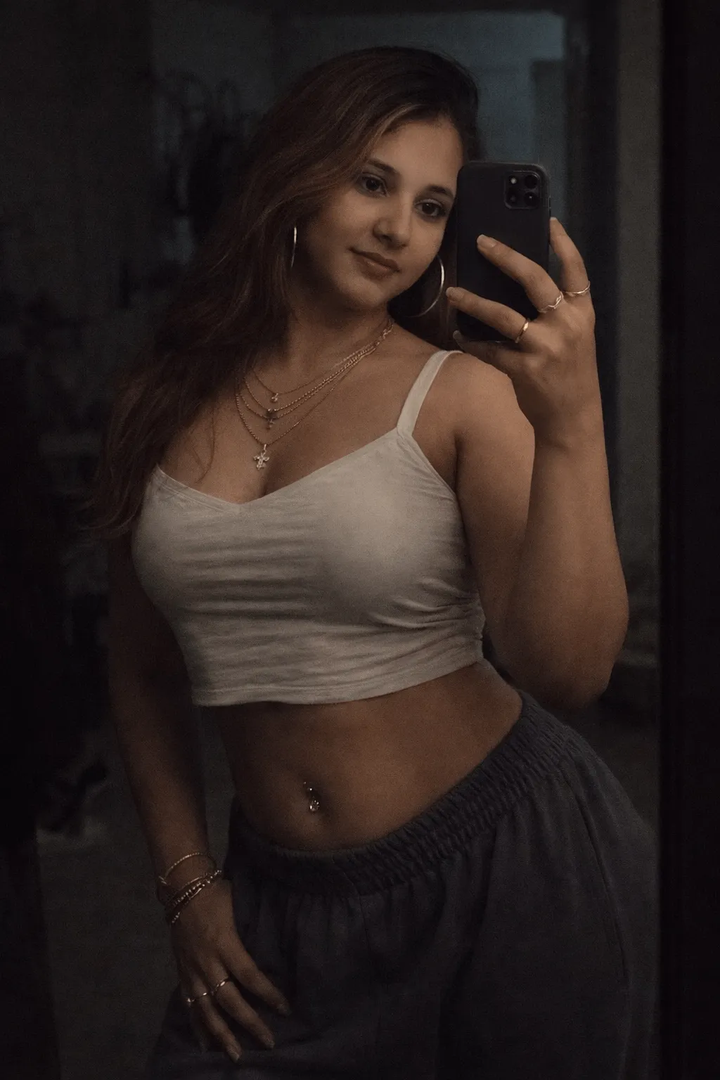 Piercings And Rings In Dim Mirror Selfie