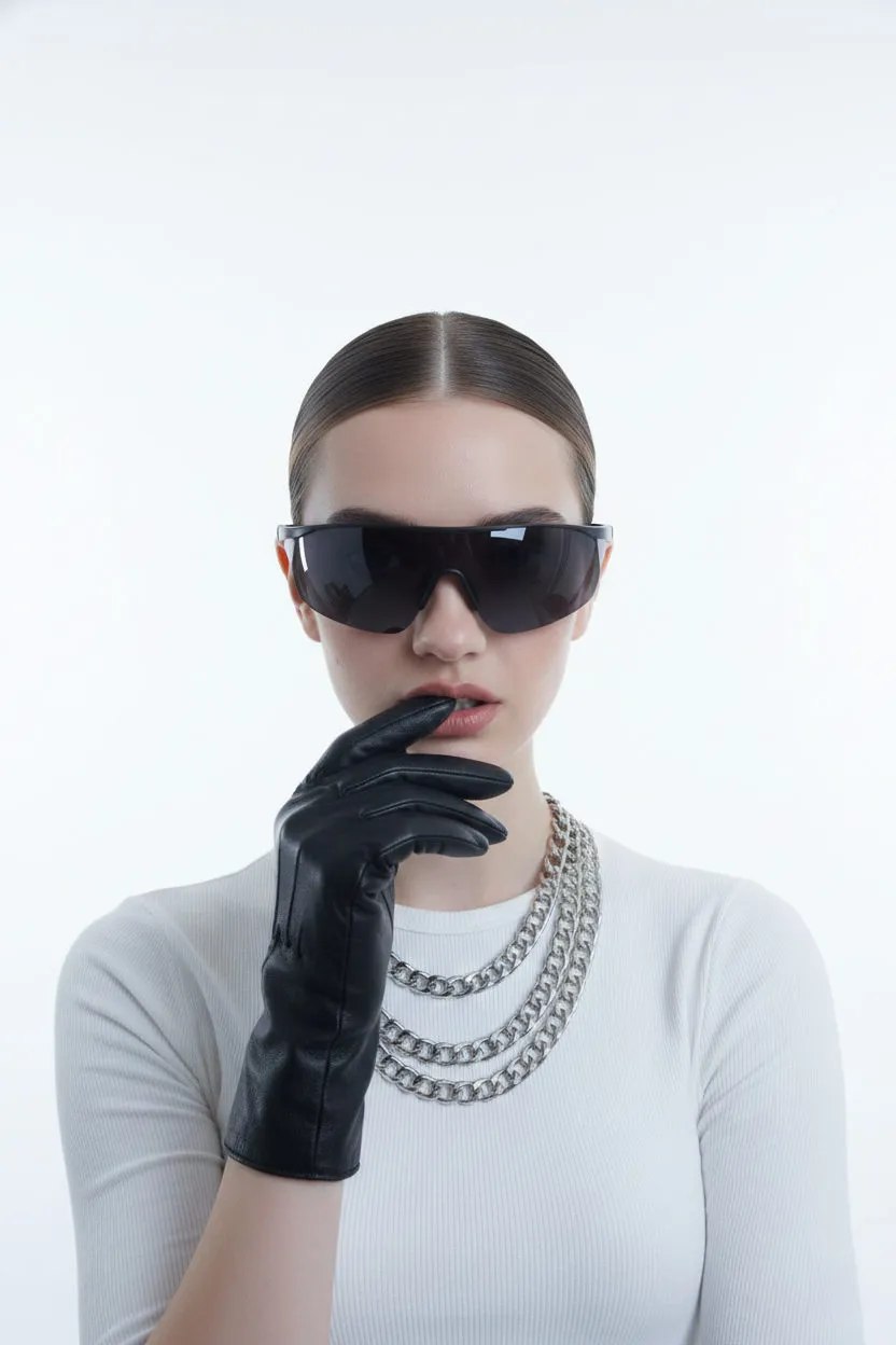 Sunglasses And Necklace In Studio Portrait