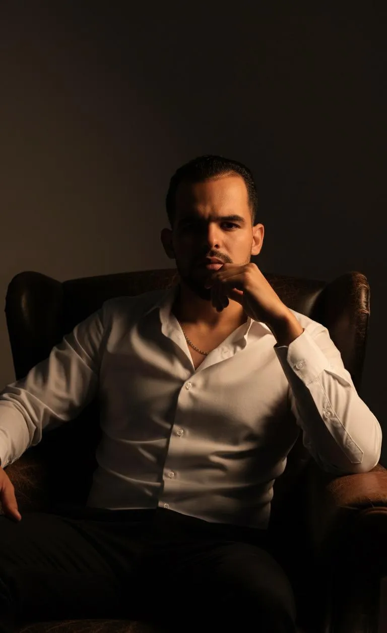 Elegant Man In Leather Armchair