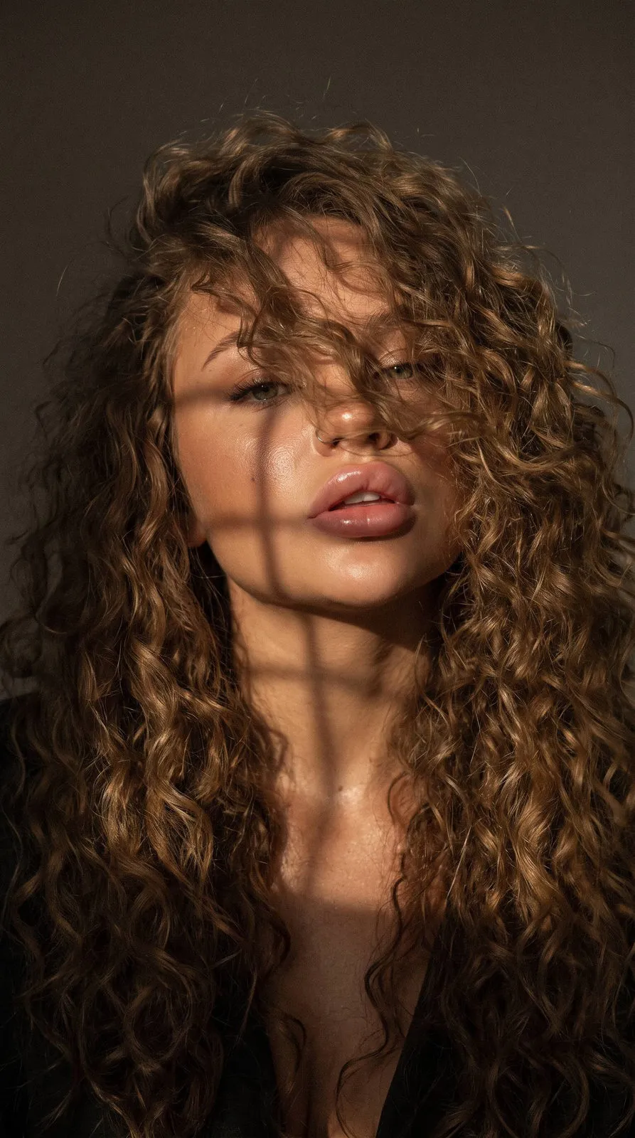 Mysterious Face With Curly Hair And Lattice Light
