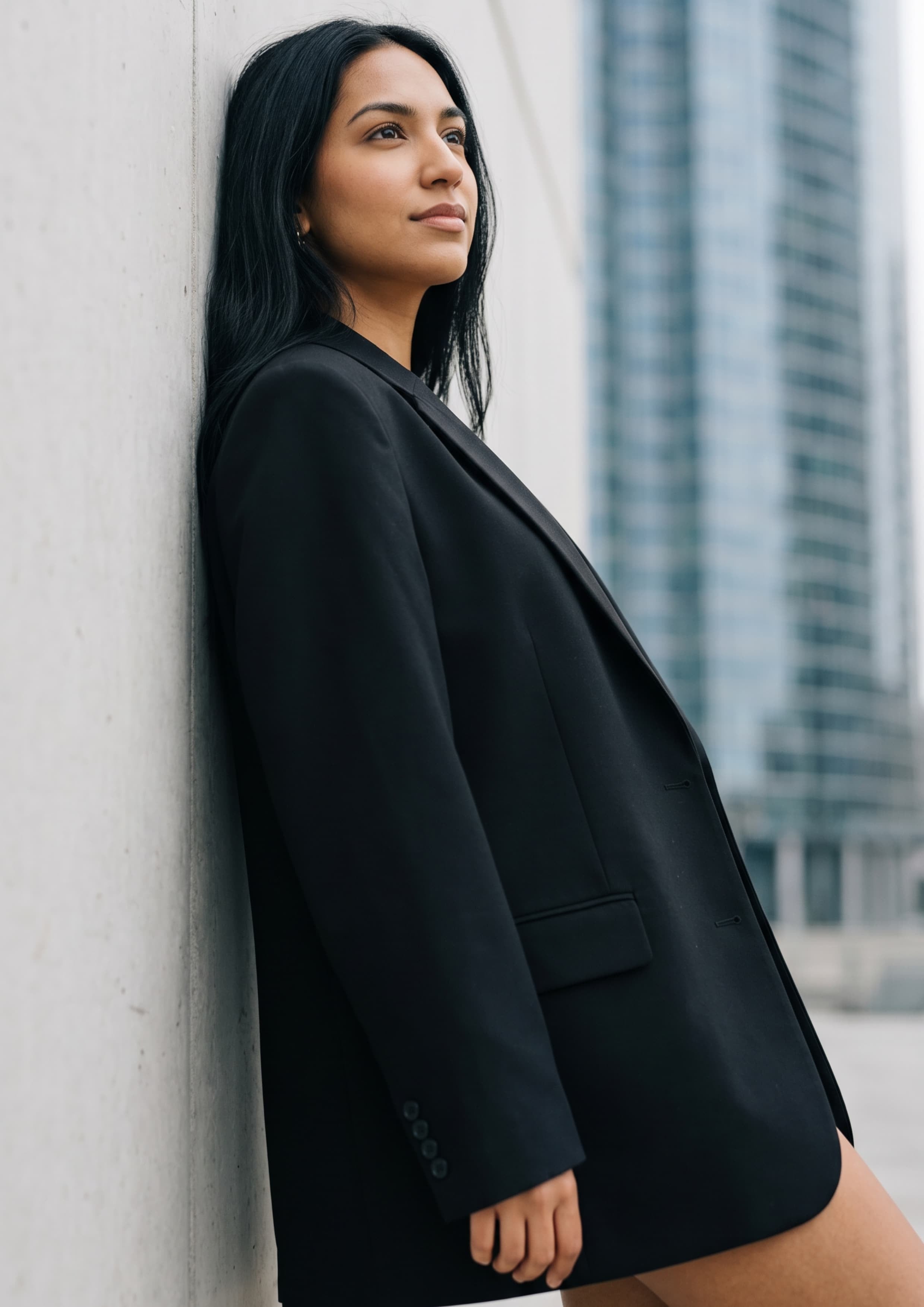 Black Blazer Against Concrete Skyscraper reference photo