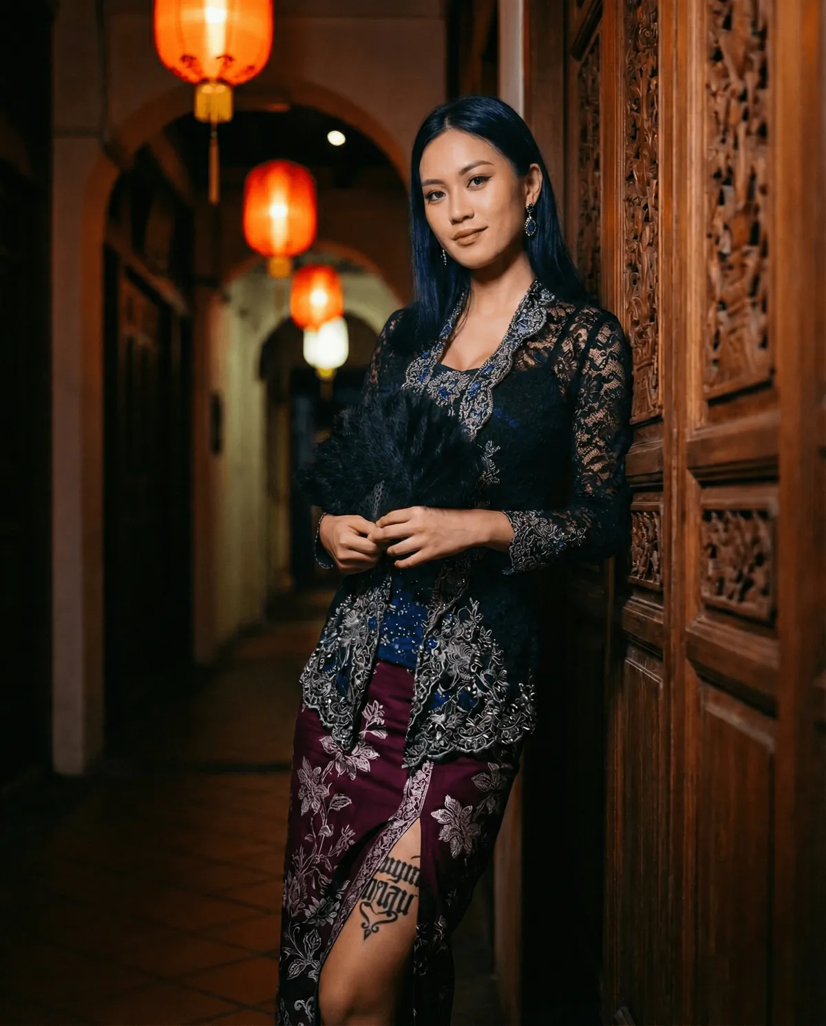 Kebaya Sarong Dimly Lit Corridor Feathered Fan Tattoo