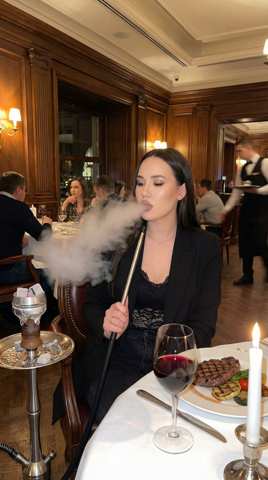 A girl in a stylish black blazer sits at a restaurant table with hookah smoke swirling around her, featuring steak and wine.