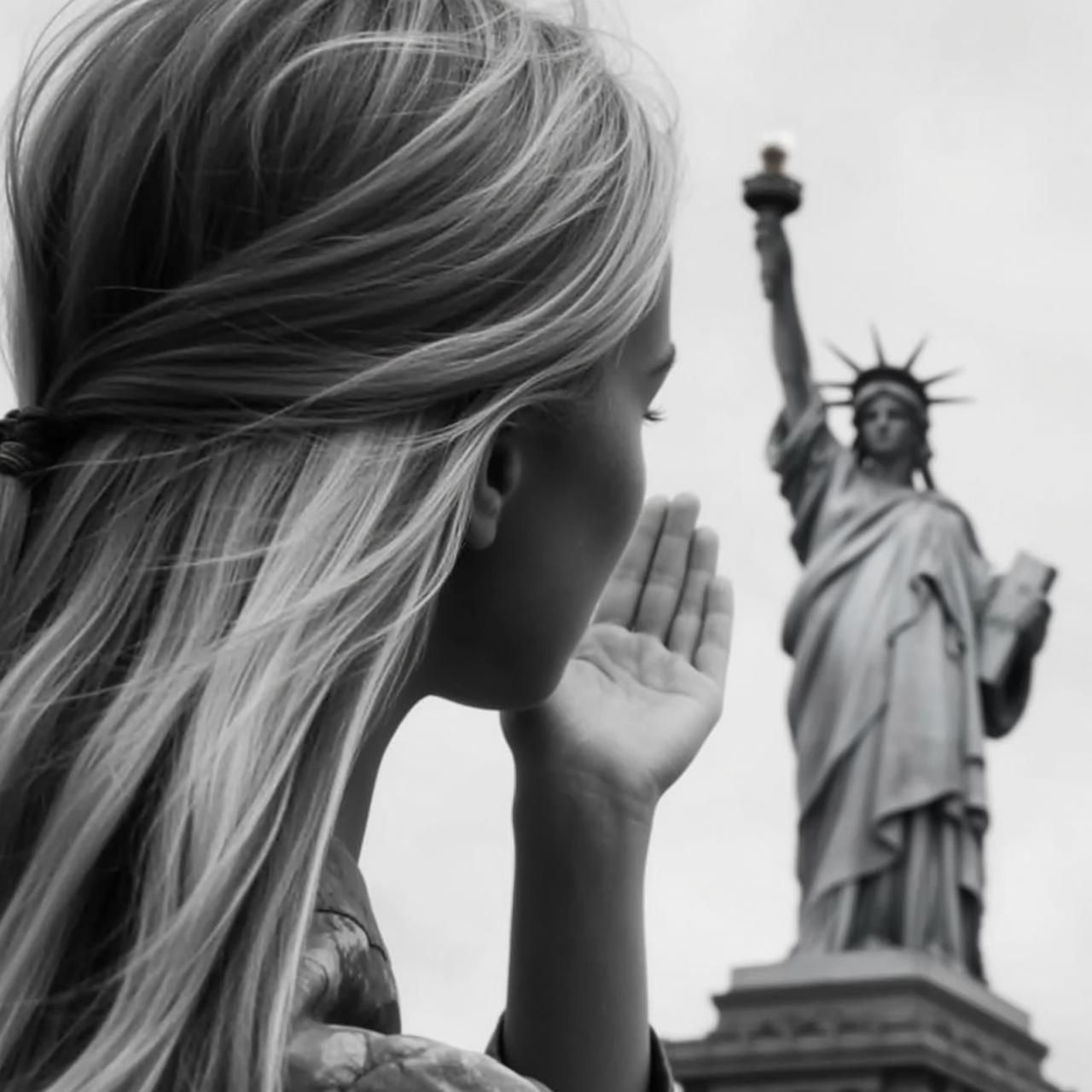 Black And White Medium Shot Eye-level Photograph Captures Young Woman