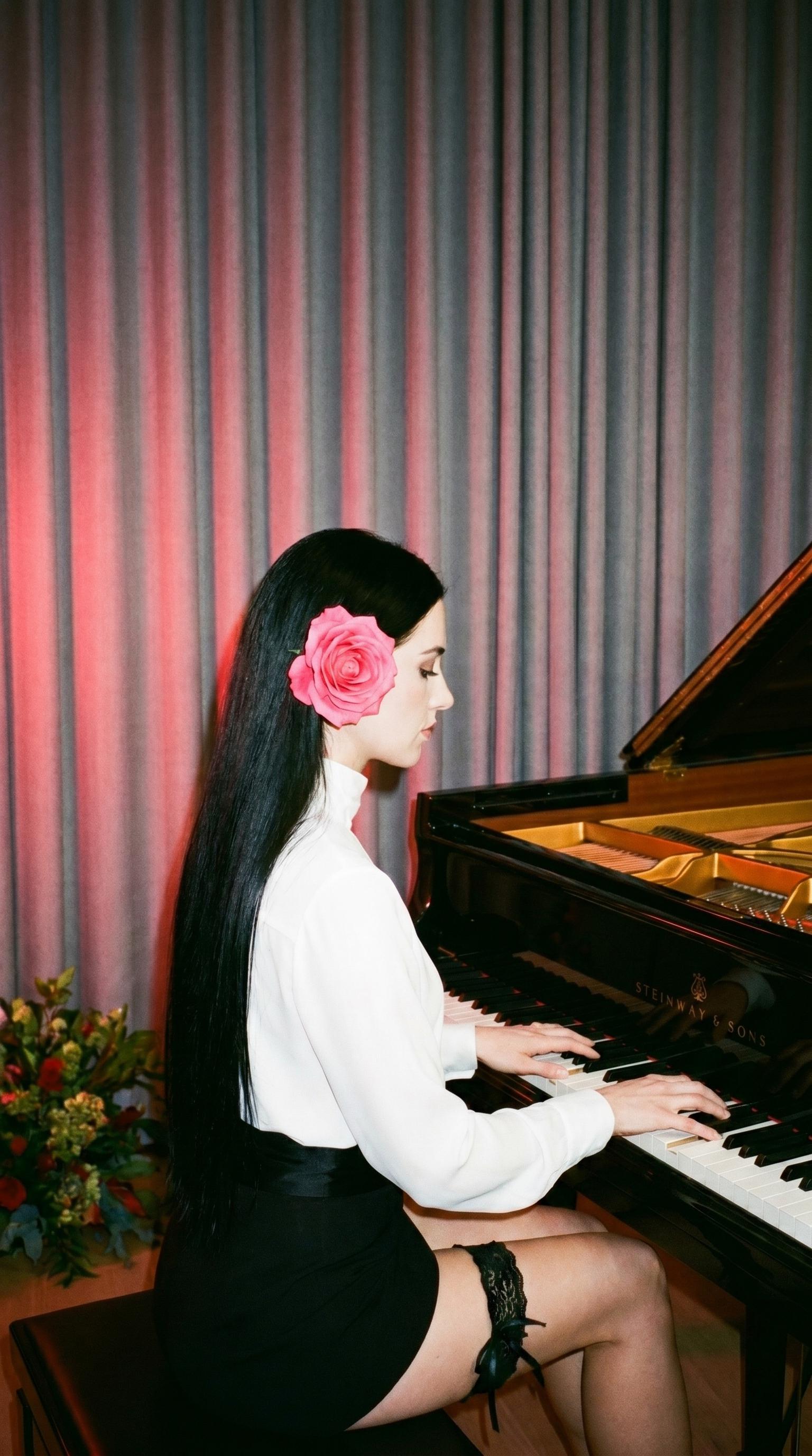 White Blouse Black Skirt At Steinway Piano