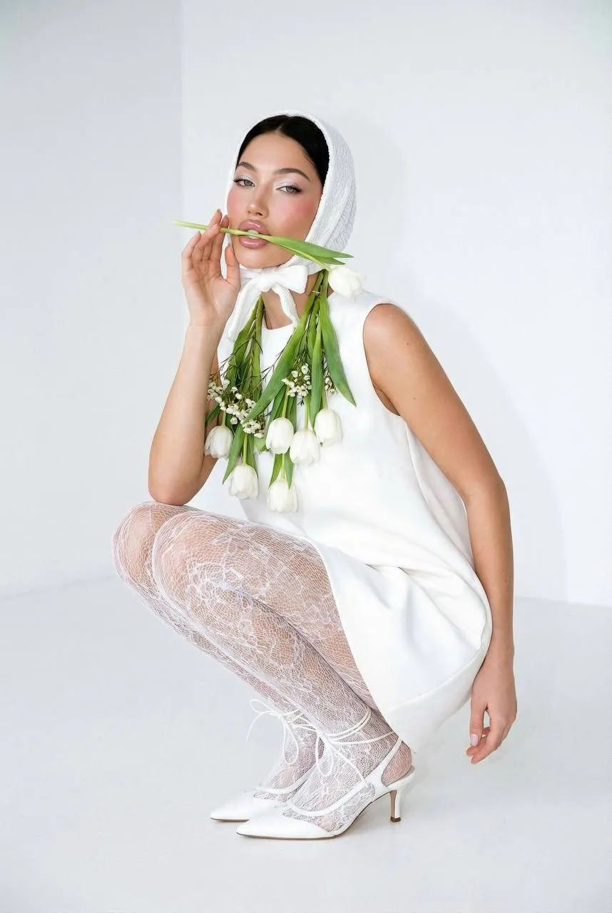 Makeup In A White Floral Studio Portrait