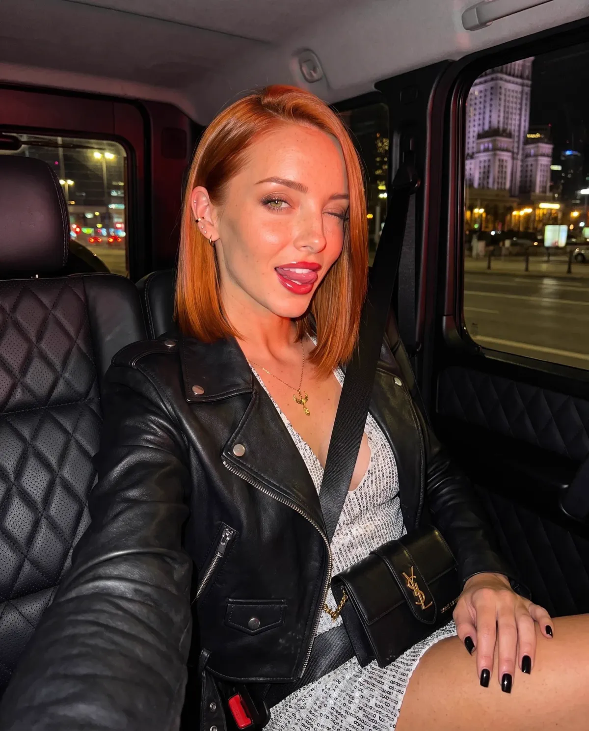 Red Haired Woman In Car At Night