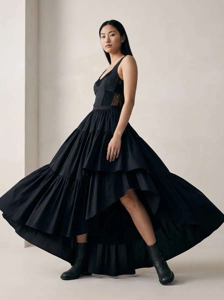 Tiered Black Gown Dynamic Pose Neutral Wall