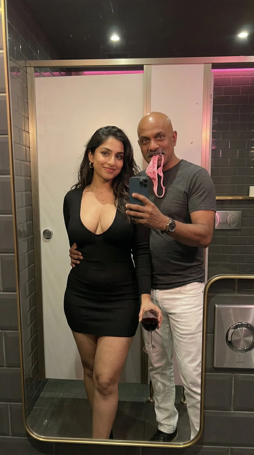 Couple Mirror Selfie Dimly Lit Restroom Wine