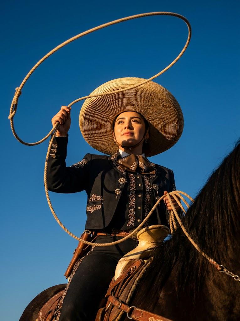 Charra On Horseback Lasso In Golden Hour Sunlight
