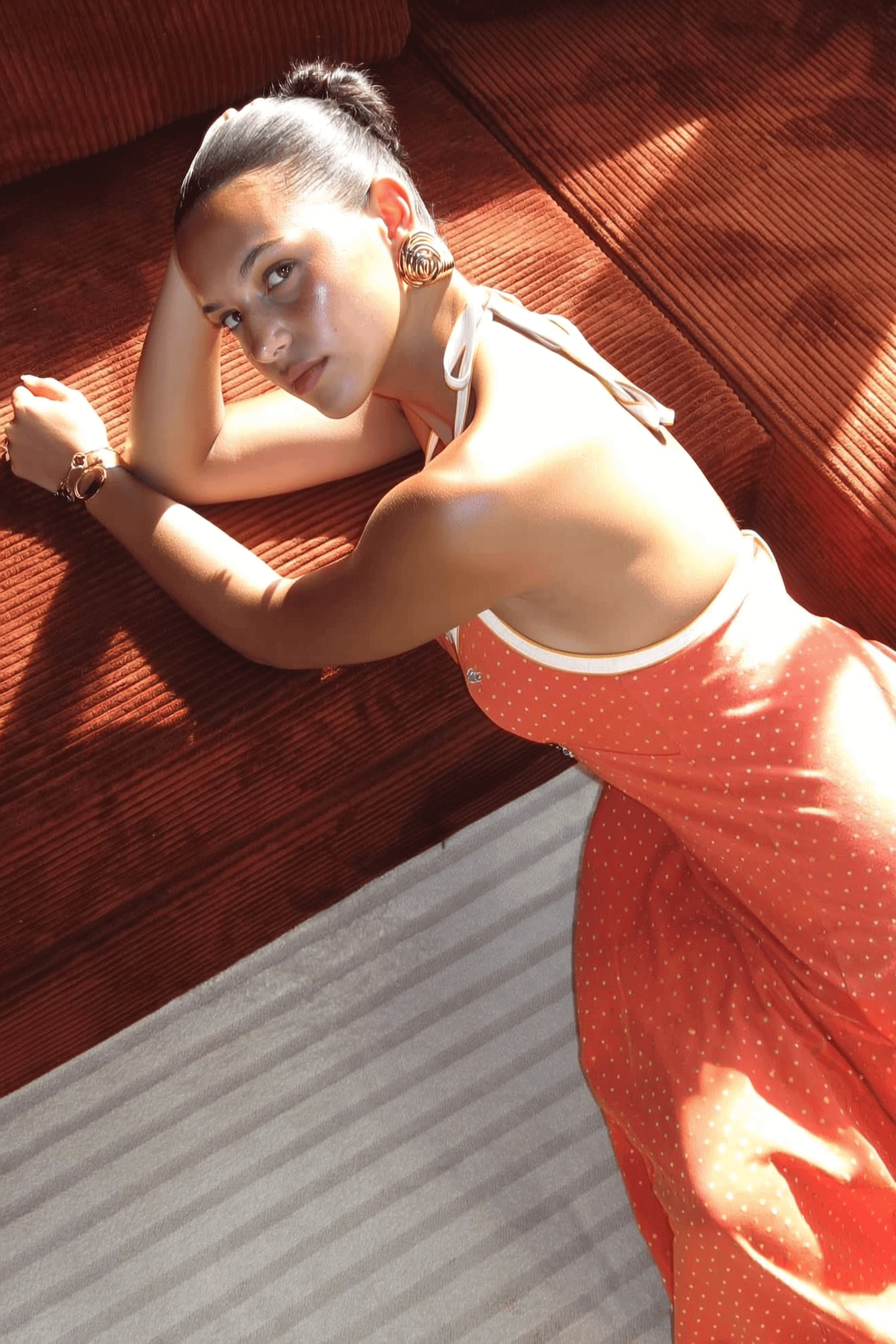 Orange Polka Dot Dress On Rust Sofa Warm Light