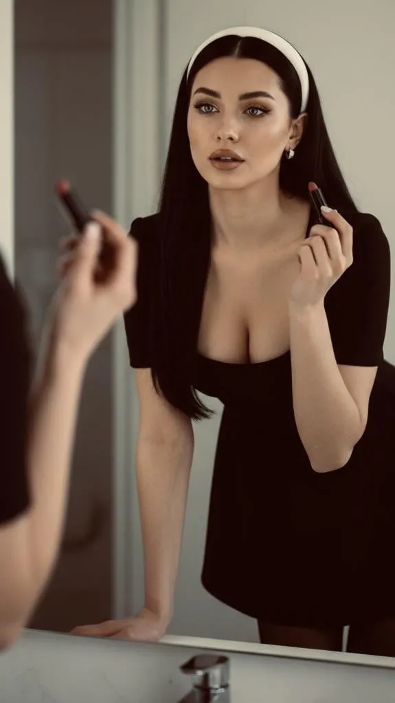 Mirror Reflection Of Woman Applying Lipstick