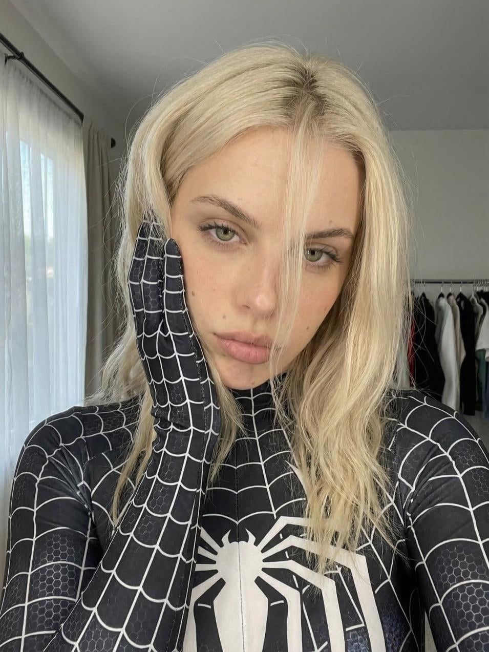 Black Web Pattern Suit And Sleek Hood In Head