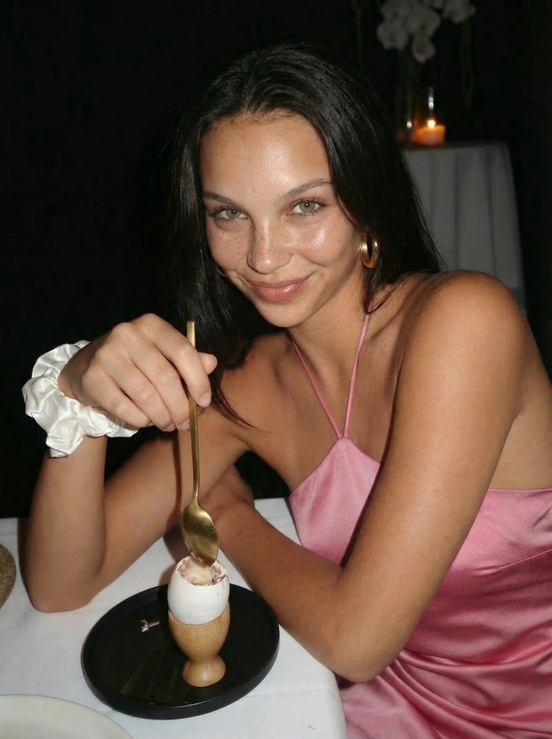 White Clothed Dining Table In Dim Restaurant Looking
