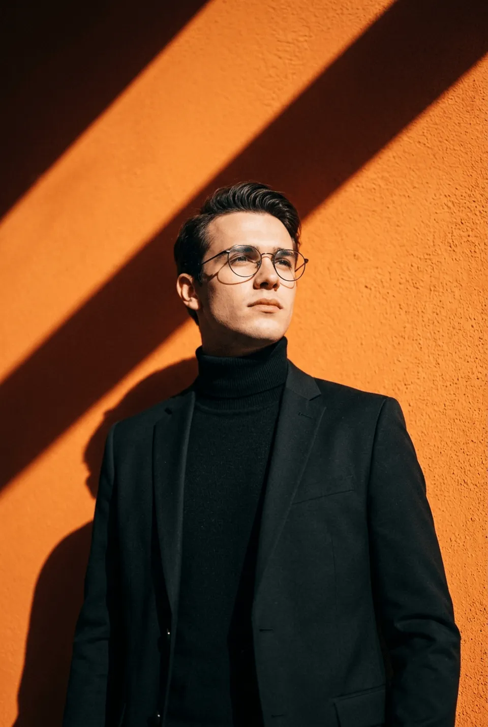 Black Turtleneck Blazer Orange Wall Diagonal Sun