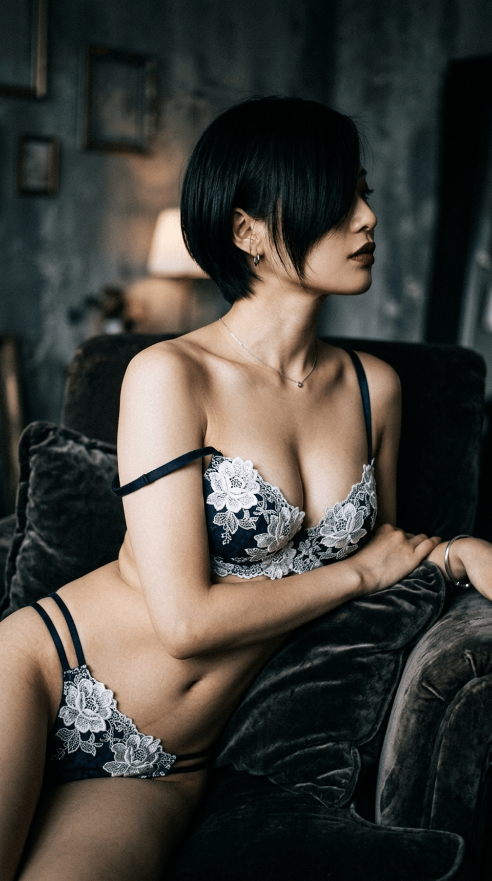 A young woman in soft lighting, showcasing natural beauty and gentle shadows.