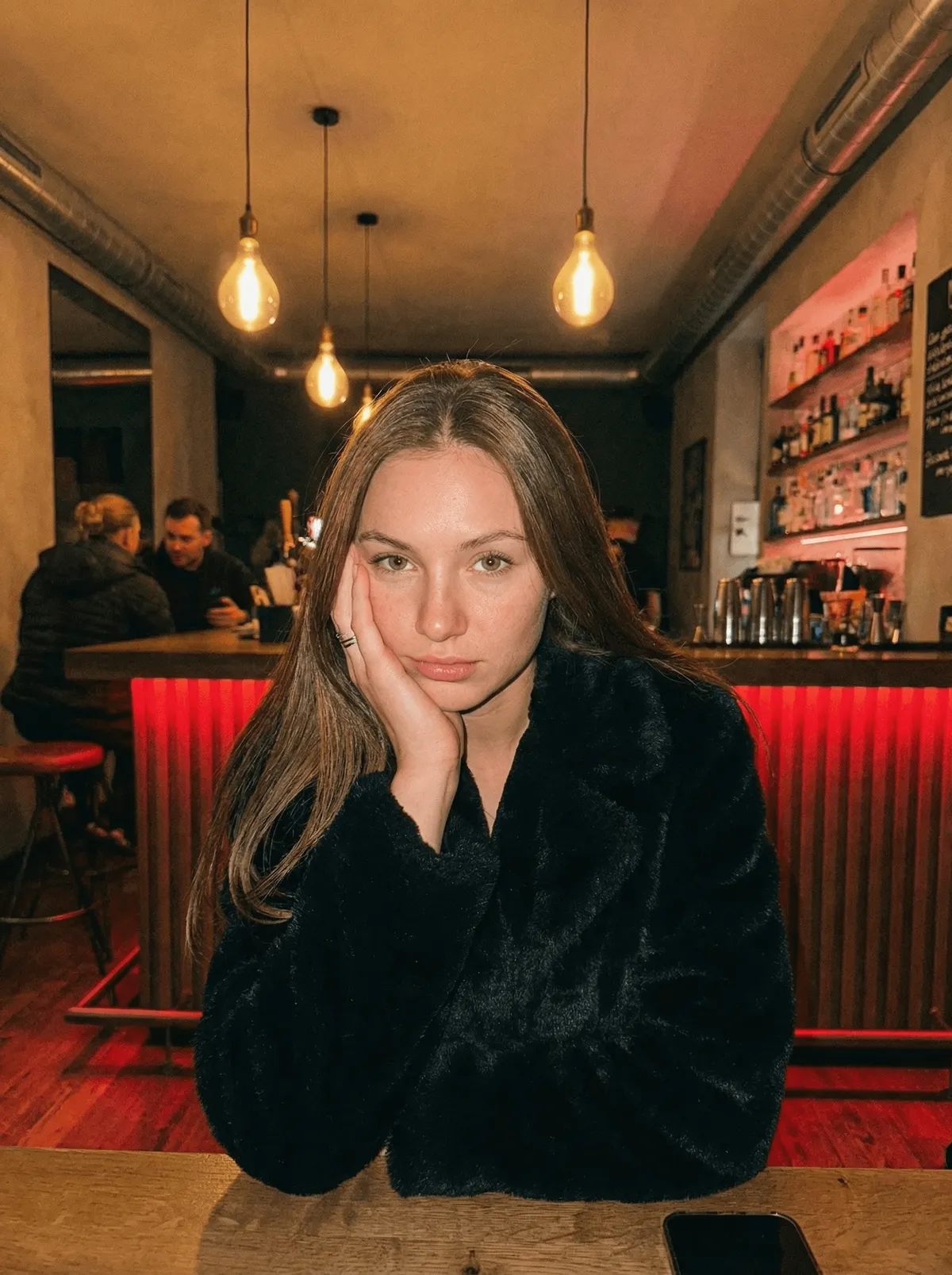 Faux Fur Coat At Dimly Lit Bar