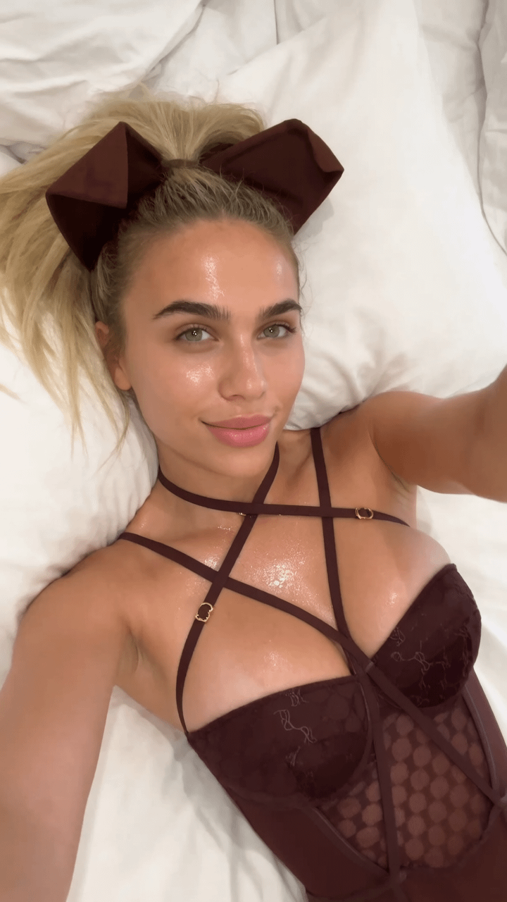 High Angle Selfie White Bed Rumpled Linens Ponytail Bow Bodysuit
