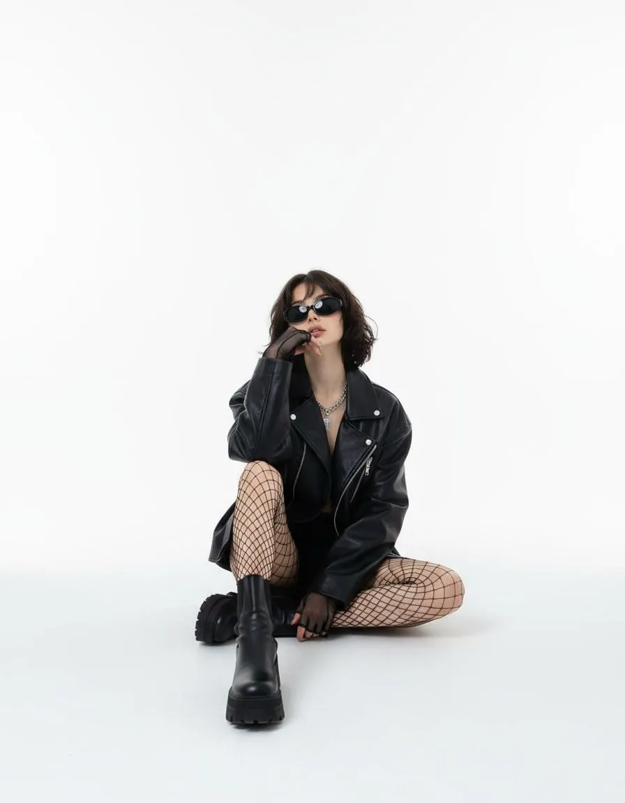 Sunglasses And Necklace In A Studio