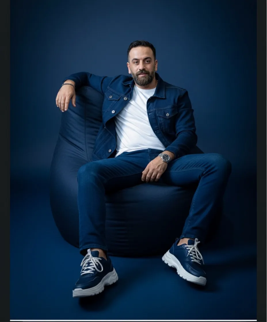 Man In Denim On Beanbag